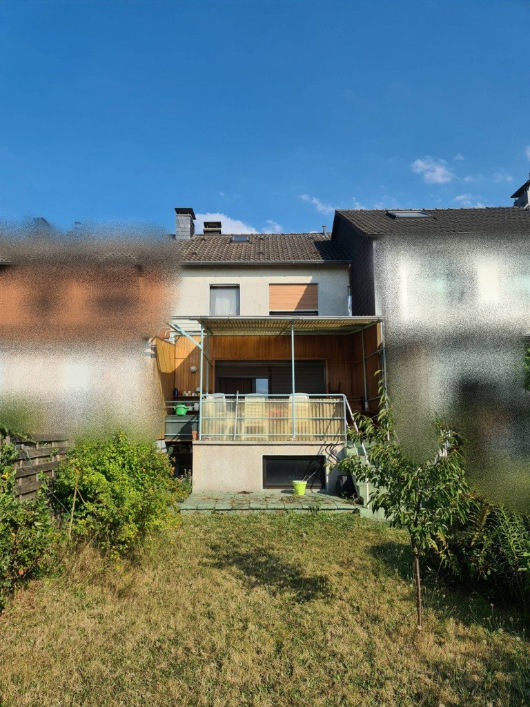 R�ckansicht Ratingen Reihenmittelhaus Kleines Reihenhausjuwel mit Garten im ruhigen Ratingen-Ost wartet auf Veredelung